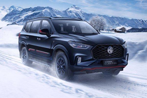 a black car driving on snow